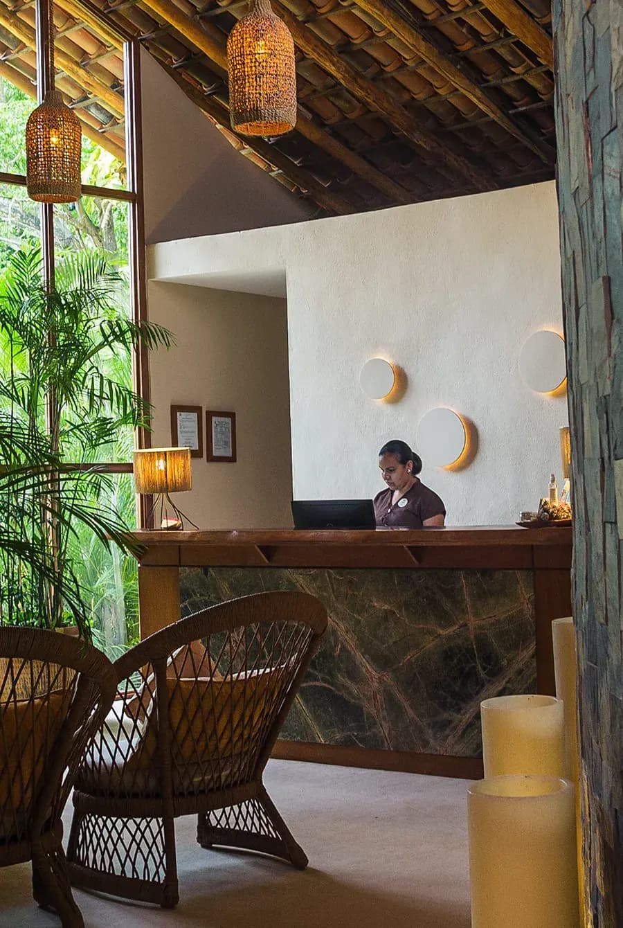Spa reception desk with a staff member attending
